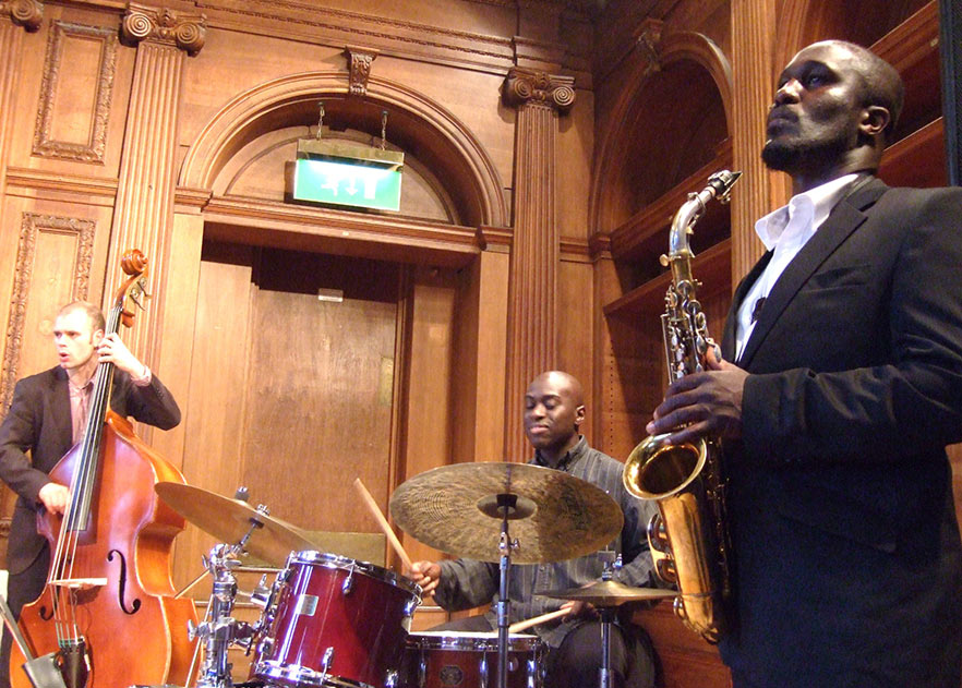 3 of the 4 members of the Tony Kofi Quartet (L-R: Ben Hazleton, Winston Clifford and Tony Kofi. (Photo: Andy Newcombe on Flickr)